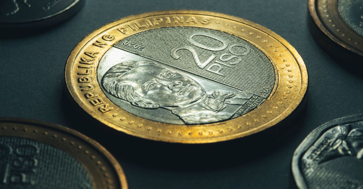 Detailed shot of a 20 peso coin from the Philippines highlighting its design.